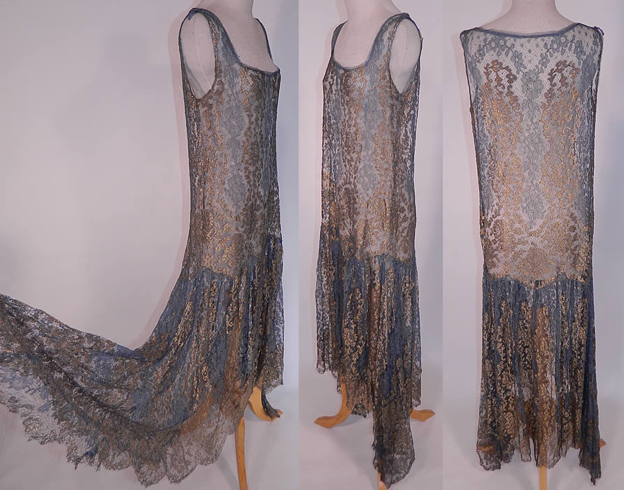 Art Deco Blue Net Gold Lam&eacute; Lame Lace Handkerchief Skirt Drop Waist Flapper Dress
This fabulous flapper style drop waist dress is sleeveless, with a squared scoop front neckline, an uneven asymmetrical handkerchief hemline full skirt, longer along the sides, with a scalloped bottom hem and is sheer, unlined. 