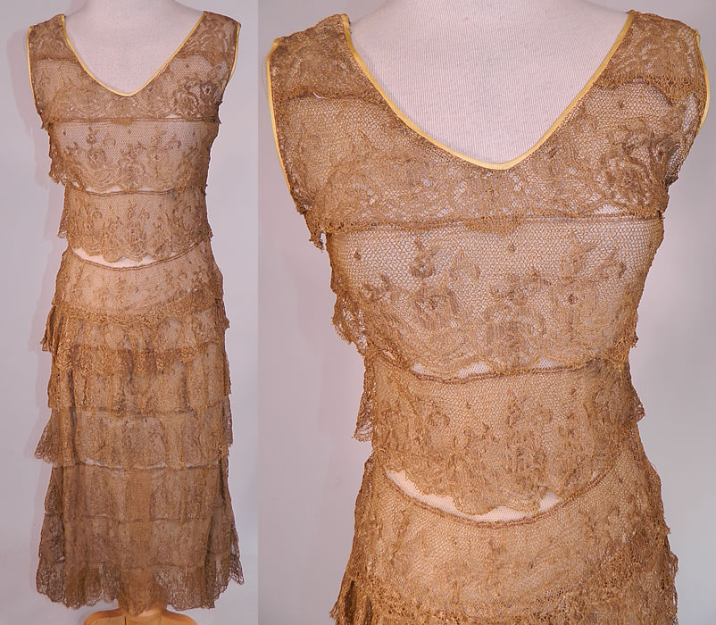 Vintage Gold Metallic Lam&eacute; Lame Lace Layered Tiered Ruffle Tango Flapper Dress 
This vintage gold metallic lam&eacute; lace layered tiered ruffle tango flapper dress dates from the late 1920s. It is made of a sheer gold metallic lam&eacute; lace, floral pattern, scalloped ruffle trim fabric.