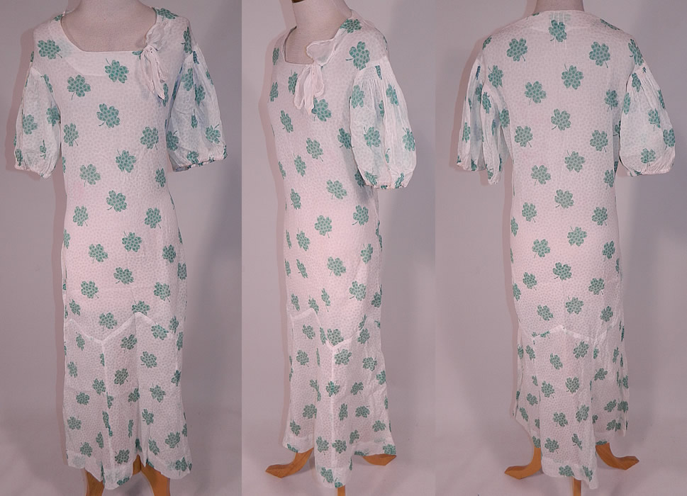 Vintage Green Shamrock Clover Print White Cotton Bias Cut St. Patricks Day Dress
This vintage green shamrock clover print white cotton bias cut St. Patrick's day dress dates from the 1930s. It is made of a sheer white cotton organdy fabric, with a green shamrock clover novelty print design down throughout. 
