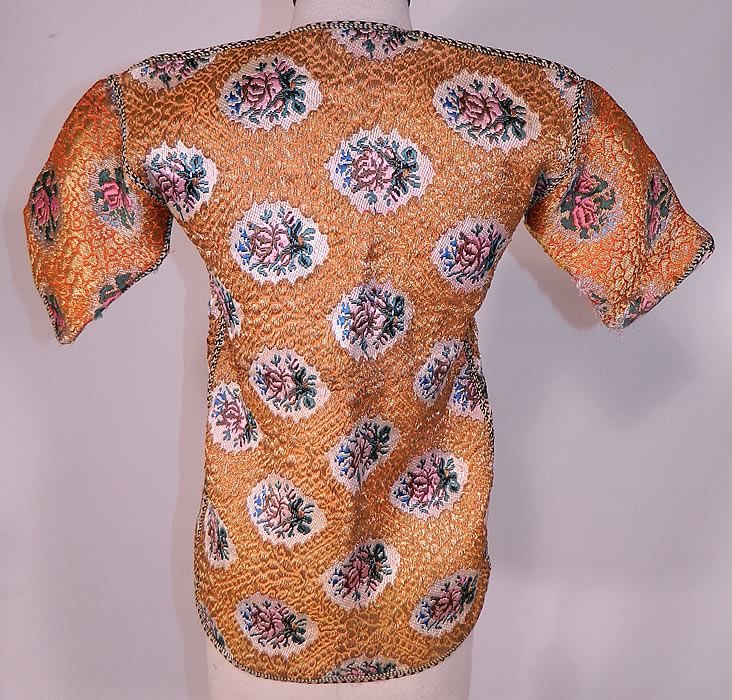 Antique Bukhara Uzbekistan Gold Lam&eacute; Lame Brocaded Childs Chapan Coat
The coat measures 21 inches long, with a 30 inch waist, 30 inch chest, 8 inch long sleeves and 11 inch circumference arm holes. 