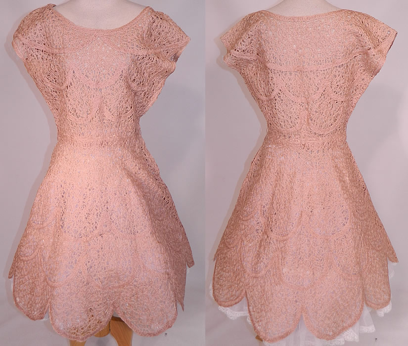 Vintage Blush Pink Sheer Scalloped Ribbonwork Hand Knit Crochet Circle Skirt Dress
This vintage blush pink sheer scalloped ribbonwork hand knit crochet circle skirt dress dates from the 1950s. It is made of a blush pink apricot color hand knit crochet fabric, with a sheer ribbonwork woven circular scalloped decorative designs. 