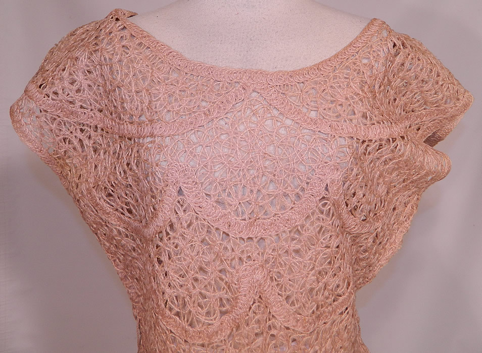 Vintage Blush Pink Sheer Scalloped Ribbonwork Hand Knit Crochet Circle Skirt Dress
This pretty pink dress has a rounded neckline, short cap sleeves, a full circle skirt with scalloped hemline, a side zipper closure and is sheer, unlined. 