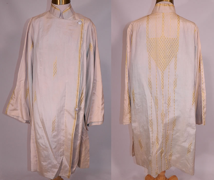 Vintage L.M. Rosen Gowns NY Label Art Deco Gold Lame Blue Silk Evening Coat Lam&eacute;
This vintage L.M. Rosen Gowns NY label Art Deco gold lam&eacute; blue silk evening coat dates from the 1920s. It is made of an iridescent pale blue, cream color raw silk fabric, with an Art Deco abstract ethnic inspired gold metallic lam&eacute; woven pattern design.