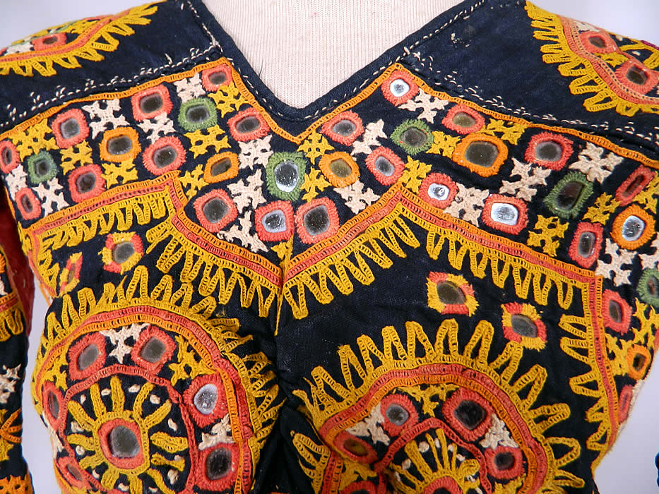 Vintage Antique Indian Gujarati Kutch Work Embroidered Mirror Choli Boho Blouse Top
It is made a hand dyed indigo blue and red linen fabric with vibrant colorful decorative crewel chain stitch kutch work embroidery done in the tribal folk patterns from Gujarati, Rajasthan India and Sindh Pakistan.
