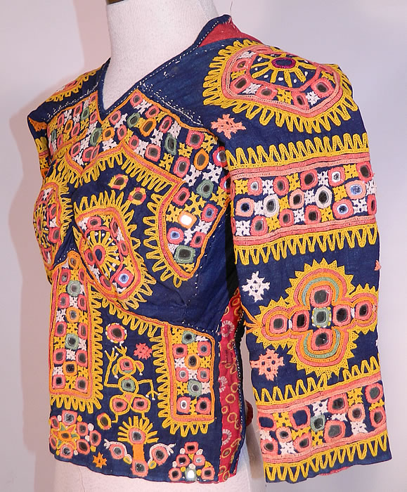 Vintage Antique Indian Gujarati Kutch Work Embroidered Mirror Choli Boho Blouse Top
The top measures 18 inches long, with a 30 inch bust, 26 inch waist and 17 inch long sleeves.