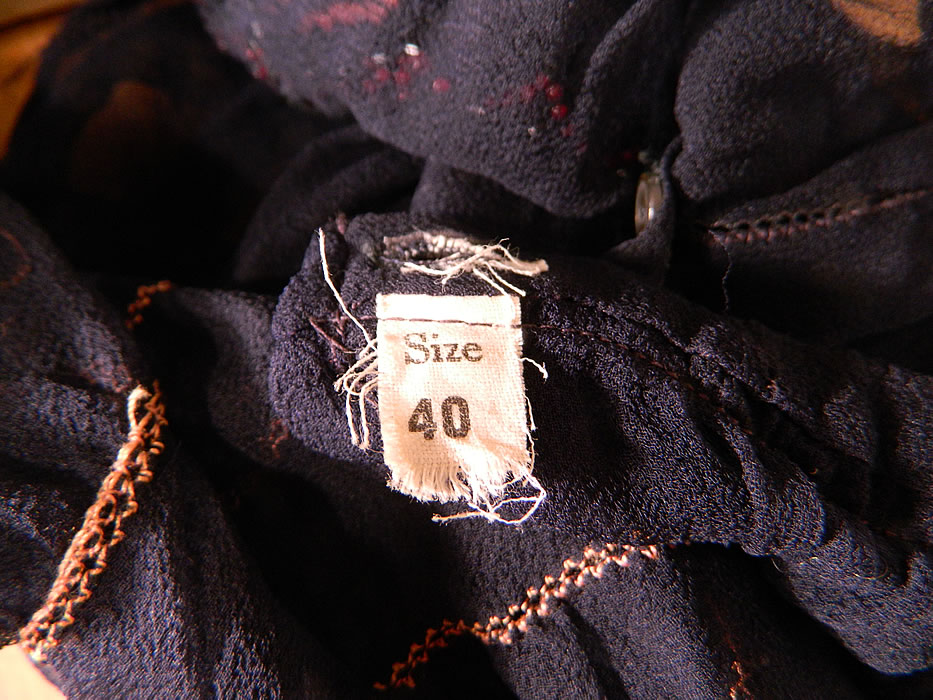   Vintage Navy Blue Sheer Silk Chiffon Embroidered Beaded Butterfly Blouse Shirt
The top measures 18 inches long, with a 26 inch waist, 36 inch bust, 22 inch long sleeves and has a Size 40 tag sewn inside the waist. 