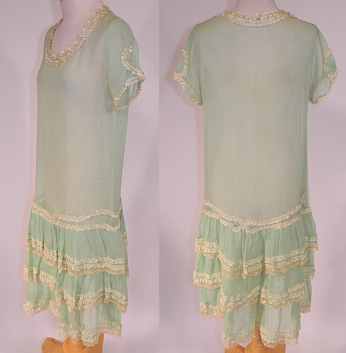 Vintage Mint Green Silk Chiffon Lace Ribbon Ruched Ruffle Trim Drop Waist Dress
It is in good condition, but has not been cleaned, with faint yellowing discoloration slight staining under the arms and on the back. This is truly a wonderful piece of wearable art!