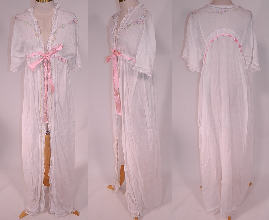 Edwardian Titanic White Cotton Rosette Embroidered Lace Peignoir Dressing Gown Robe
This vintage Edwardian Titanic era white cotton rosette embroidered lace peignoir dressing gown robe dates from 1912. It is made of a white cotton batiste fabric, with pastel floral rosette French knot embroidery work and a white lace trim edging.