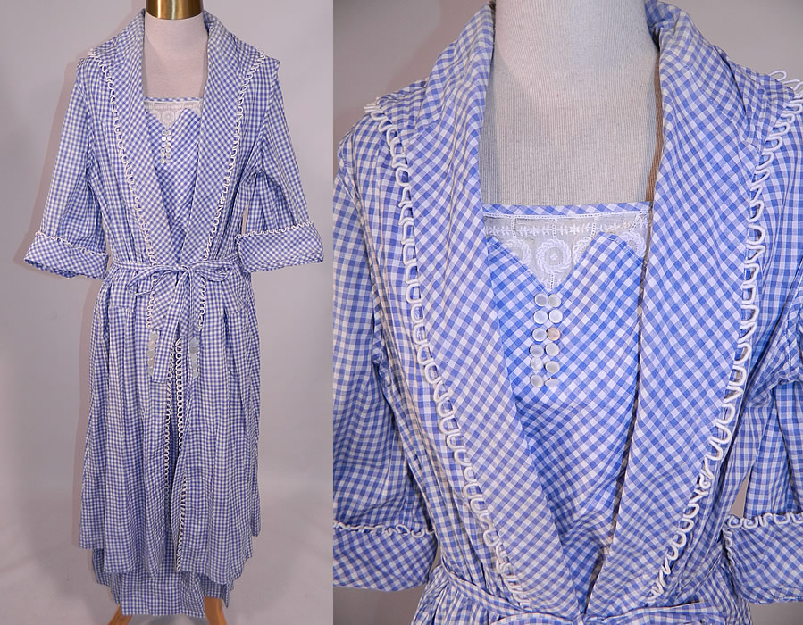 Edwardian Blue & White Gingham Check Cotton Pinafore Belted Day Dress
This vintage Edwardian era blue and white gingham check cotton pinafore belted day dress dates from 1915. It is made of a blue and white gingham check cotton fabric, with white silk rope loop trim edging, mother of pearl button trim accents and an embroidered white batiste lace yoke insert. 