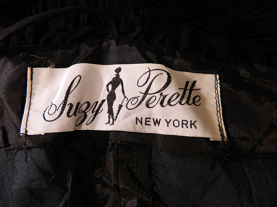 Vintage Suzy Perette NY Label Black Silk Pleated Ruffle Spaghetti Strap Cocktail Dress
There is a "Suzy Perette New York" designer label sewn inside. The dress measures 42 inches long, with 34 inch hips, a 24 inch waist and 34 inch bust. It is in excellent condition. This is truly a wonderful piece of wearable art!