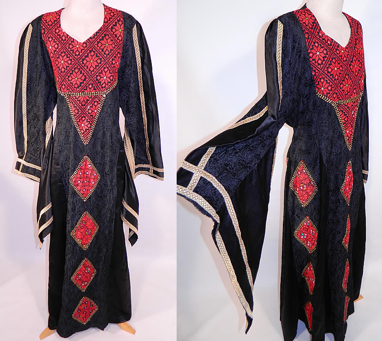 Vintage Al-Karnak Jordan Bedouin Kaftan Jalabiya Thobe Embroidered Maxi Dress
This vintage Al-Karnak Jordan bedouin kaftan jalabiya thobe embroidered maxi dress dates from the 1970s. It is made of a black silky polyester fabric with black chain stitching embroidery work done in a floral pattern and red cross stitch embroidery work done in a geometric floral design on the bib top and diamond shapes appliqu&eacute;d down the front skirt.