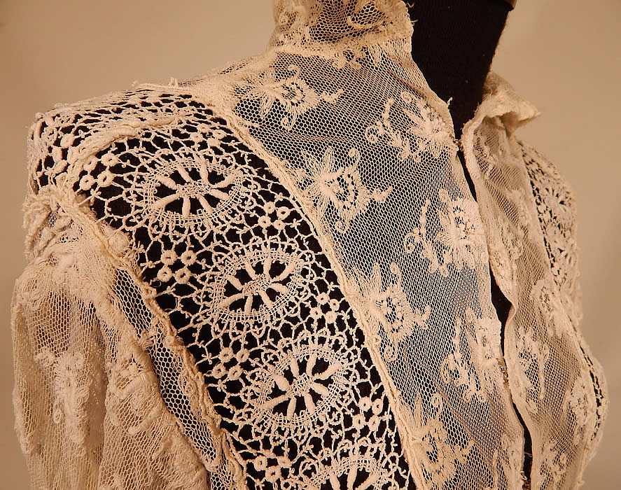 Vintage Edwardian Ecru Cream Tambour Embroidery Net Mixed Lace Blouse Jacket
This lovely lace blouse style jacket has an open front with hook closures, a fold over high neck collar, long tapered sleeves with fitted lace trim cuffs and is sheer completely unlined.