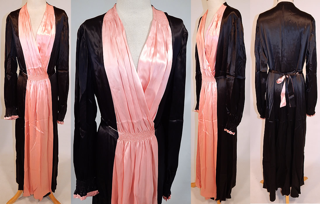 Vintage Jesfor Label Black & Pink Satin Belted Peignoir Robe Dress Gown
This vintage Jesfor label black and pink satin belted peignoir robe dress gown dates from the 1940s. It is made of a luxurious black and pink silky satin fabric, with smocking ruched gathering details on the front waist and shoulders. This pretty pink peignoir robe dressing gown is a long floor length, with a wrap around style, long full sleeves with gathered ruffle cuffs, pleated pink front accents, an attached sash belt tie back for closure