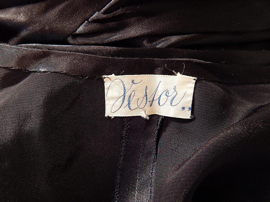 Vintage Jesfor Label Black & Pink Satin Belted Peignoir Robe Dress Gown
There is a "Jesfor,," label sewn inside. The robe measures 54 inches long, with a 40 inch waist, 42 inch bust and 27 inch long sleeves. It is in excellent condition. This is truly a wonderful unique piece of fine quality romantic wearable lingerie art!