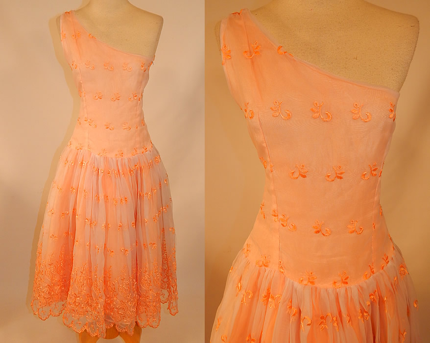 Vintage Peach Pastel Organdy Eyelet Embroidered One Shoulder Circle Skirt Dress
This vintage pastel peach eyelet embroidered one shoulder circle skirt dress dates from the 1950s. It is made of a iridescent pastel peach color sheer organdy fabric, with an eyelet embroidered cut work floral pattern design. 