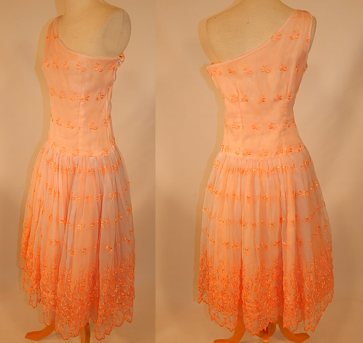 Vintage Peach Pastel Organdy Eyelet Embroidered One Shoulder Circle Skirt Dress
This pretty peach party dress has a one shoulder sleeveless style, with a long waist, full circle skirt, side zipper closure and is fully lined. 