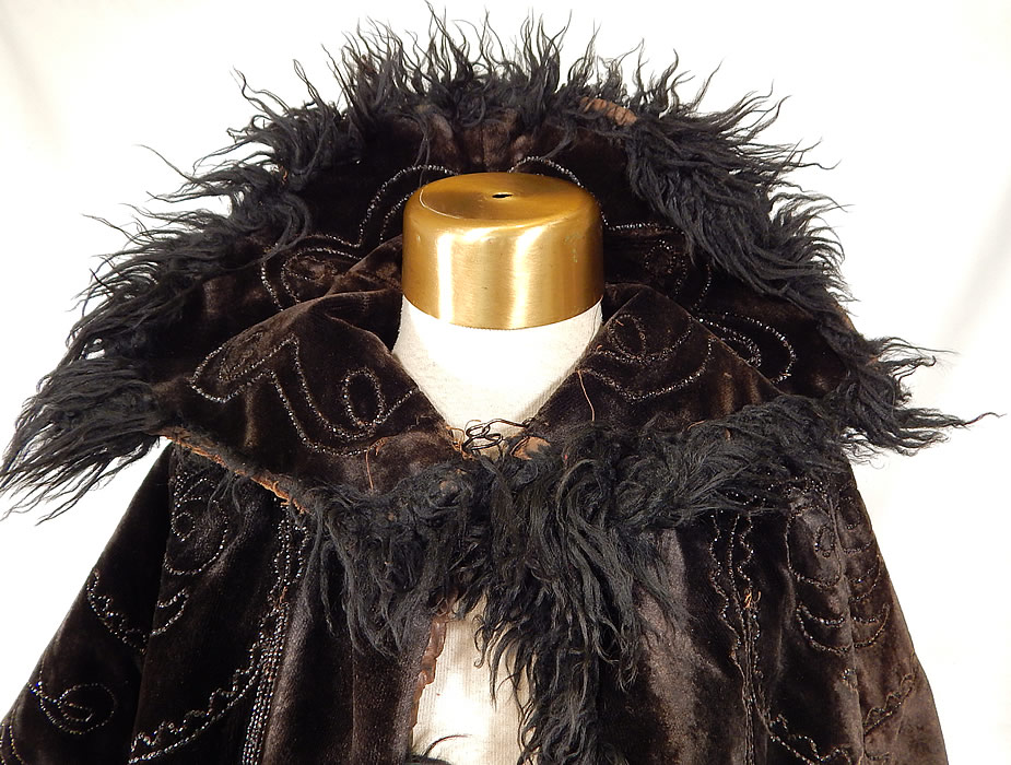 Victorian Black Velvet Jet Beaded Mohair Trim Winter Cloak Cape Mantle
 It is in good condition, with only some wear along the velvet nap and is missing 3 inches of mohair trim on the collar edging (see close-up). This is a wonderful piece of antique Victoriana winter mourning wearablee art!