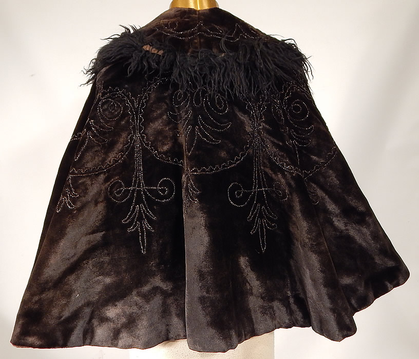 Victorian Black Velvet Jet Beaded Mohair Trim Winter Cloak Cape Mantle
 This wonderful winter mantle cloak cape has a large collar which can be worn up or folded down, a flared full swing bottom, fully lined in a quilted silk fabric for warmth and hook closure at the neck. 