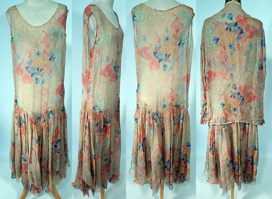 Vintage Art Deco Colorful Abstract Print Silk Chiffon Drop Waist Dress & Jacket
This fabulous flapper dress is loose fitting, with a drop waist, sleeveless top, an uneven handkerchief hemline skirt and is sheer, unlined. The dress is a large size measuring 49 inches long, with 44 inch hips, a 34 inch waist and 40 inch bust. 
