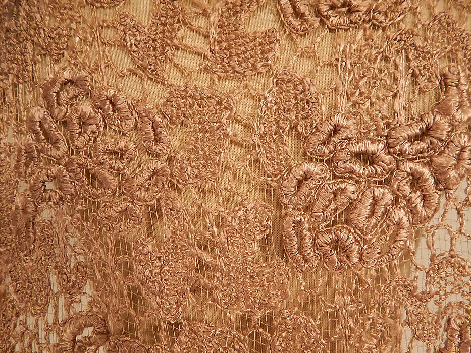 Vintage Ecru Embroidered Crochet Lace Net Tabard Tunic Flapper Dress
This lovely lace tunic tabard style flapper dress has a front and back long floor length panels, with open sides, loose fitting, sleeveless, with snap closures along the shoulders and is sheer because it is unlined worn as an overdress. 