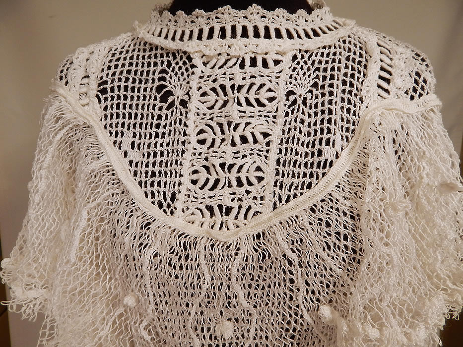 Vintage Victorian Style White Crochet Lace Flounce Ruffle Boho Maxi Dress
This beautiful boho chic Victorian inspired maxi dress has a flounce ruffle shawl collar, long sleeves, a long full skirt with ruffle trim, a belted sash tie back, crochet button closures down the back and is sheer, unlined. 
