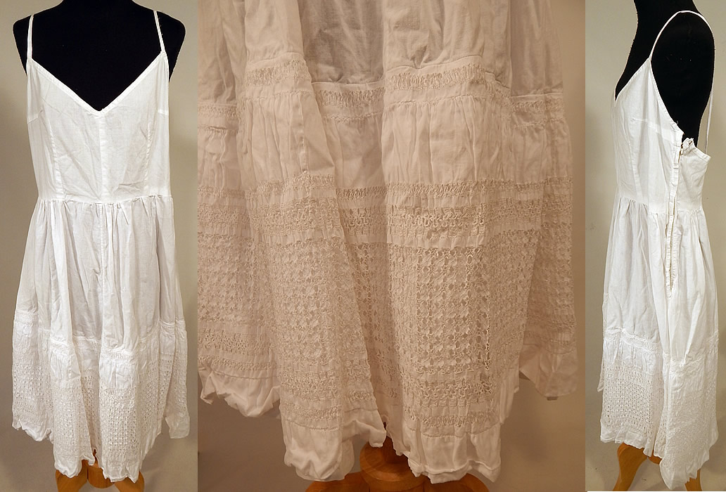 Edwardian White Cotton Linen Drawnwork Lace Camisole Top & Full Slip Dress
The top measures 17 inches long, with a 24 inch waist and 36 inch bust. There is a full slip dress with matching fabric bottom petticoat skirt and a 1950s alteration sweetheart neckline, spaghetti strap top with added size zipper closure. The slip measures 44 inches long, with a 28 inch waist and 34 inch bust. 