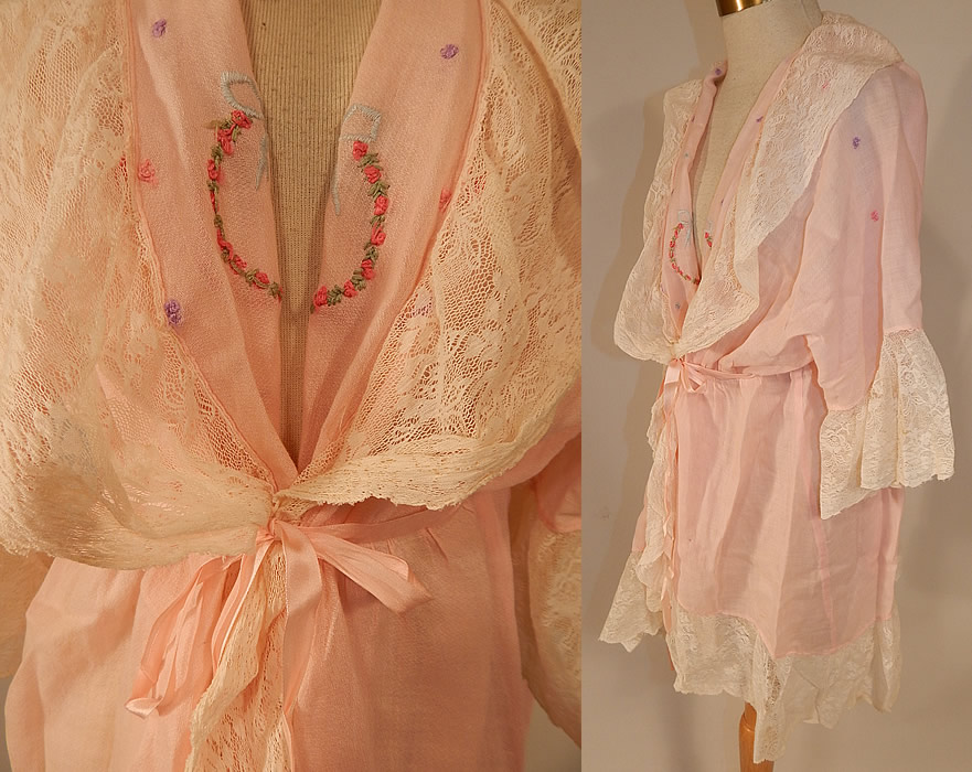 Vintage Pink Cotton Embroidered Rosette Lace Trim Flapper Peignoir Robe Bed Jacket
This beautiful boudoir peignoir robe bed jacket is loose fitting, a long mid length, with lace ruffle trim edging, 3/4 length sleeves, lace cuffs, a pink silk ribbon belted tie sash front and back for closure. 
