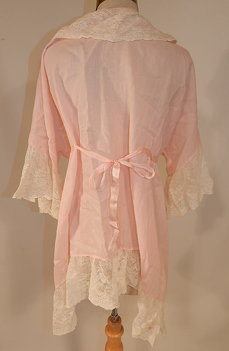 Vintage Pink Cotton Embroidered Rosette Lace Trim Flapper Peignoir Robe Bed Jacket
The robe measures 32 inches long, with a 48 inch waist and 48 inch bust. It is in good condition. This is truly a wonderful piece of flapper wearable lingerie art!