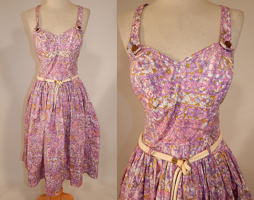 Vintage Catalina Sportswear Pink Cotton Novelty Print Belted Circle Skirt Dress
This vintage Catalina Sportswear pink cotton novelty print belted circle skirt dress dates from the 1950s. It is made of shades of pink, purple, gold and white cotton fabric, with an abstract floral patchwork novelty print design.