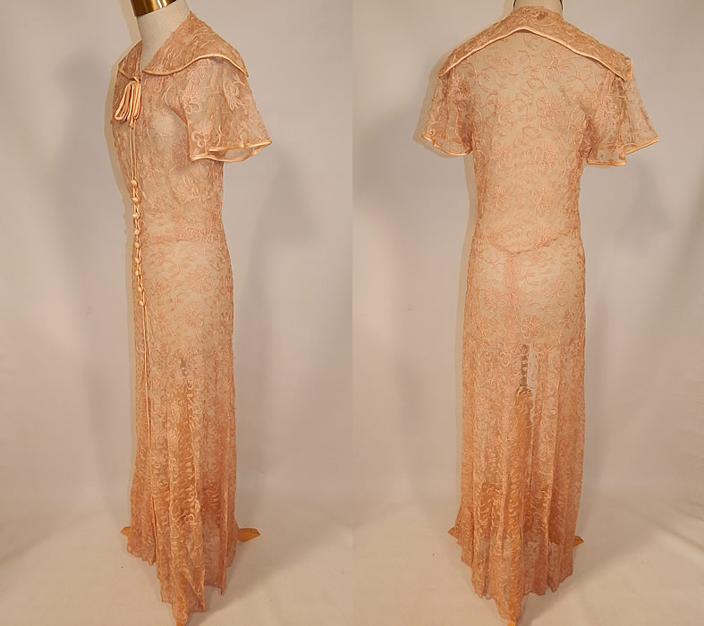 Vintage I. Magnin & Co Pink Tambour Embroidery Net Lace Peignoir Robe Dressing Gown
It is made of a pale pink ecru cream color sheer tambour embroidery net lace fabric, with a floral vine leaf design and pink silk ribbon trim edging. 