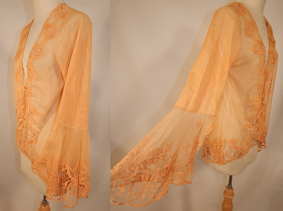 Vintage Antique Peach Ecru Net Battenburg Lace Coat Jacket Bell Sleeves
This lovely lace coat jacket has a loose fitting mid length style, open front, no closure, long full bell sleeves with wide flared open slit cuffs and is sheer, unlined. 