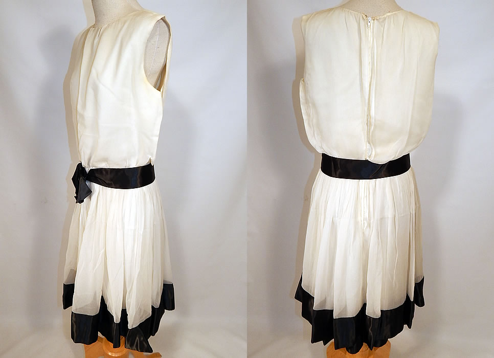 Vintage Mod Black & White Chiffon Belted A Line Sleeveless Cocktail Dress
This marvelous mod cocktail dress has an A line style, sleeveless, a pleated flared full skirt, fitted waist with attached belt, back zipper closure and is fully lined.