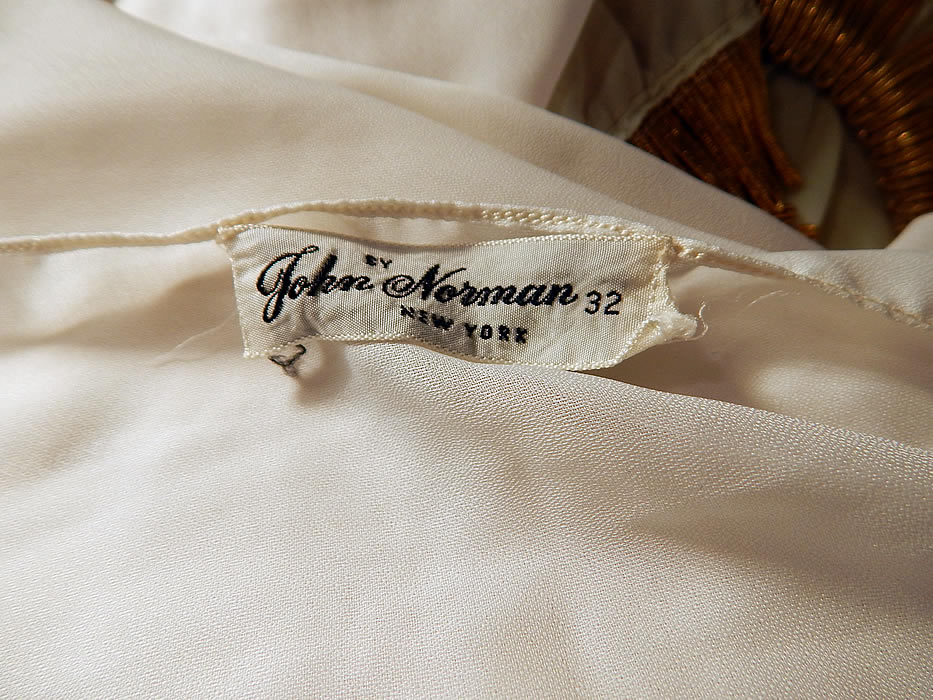 Vintage John Norman Lord & Taylor White Chiffon Grecian Goddess Gown
There is a matching fabric scarf shawl stole wrap which measures 94 inches long and 22 inches wide. Both have a "By John Norman New York" lingerie designer label and "Lord & Taylor Fifth Avenue" store label, size 32 tag sewn inside. 