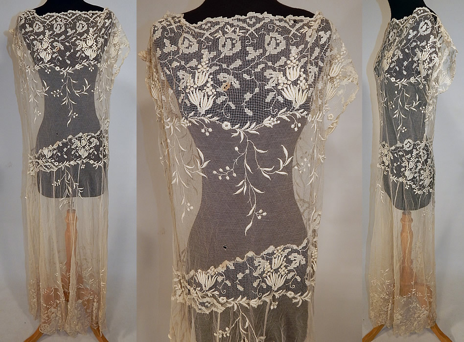 Vintage Cream Filet Lace Embroidered Tulle Net Drop Waist Boho Maxi Dress
This vintage cream filet lace embroidered tulle net drop waist boho maxi dress dates from the 1920s. It is made of an off white cream color sheer tulle net filet lace fabric with raised padded satin stitch embroidery work done in a floral vine leaf design.