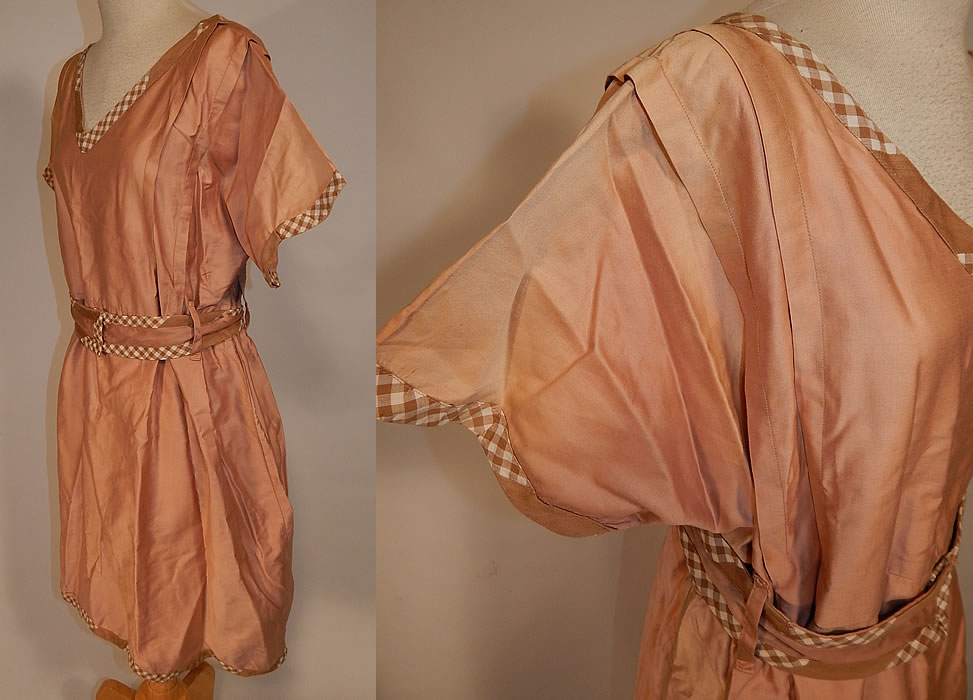 Vintage Edwardian Tan Cotton Gingham Trim Belted Bathing Swimsuit Dress
This wonderful women's old fashioned bathing suit costume dress has a V front neckline, pleated trim along the shoulders, short sleeves, a fitted waist, matching fabric belt with snap closures on the front and is missing the bloomers pantaloons which would have been worn underneath. 