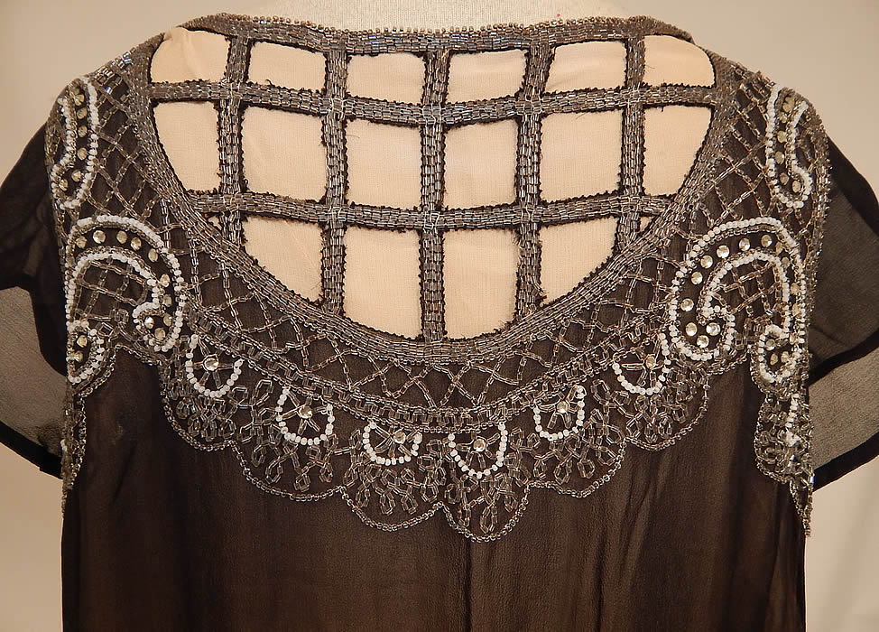 Vintage Art Deco Black Silk Chiffon Lattice Rhinestone Beaded Handkerchief Flapper Dress
The dress measures 48 inches long, with 36 inch hips, a 36 inch waist and 38 inch bust. 