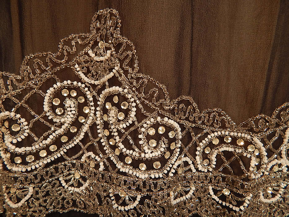 Vintage Art Deco Black Silk Chiffon Lattice Rhinestone Beaded Handkerchief Flapper Dress
It is in excellent condition. This is truly a wonderful piece of Art Deco wearable beaded textile art!