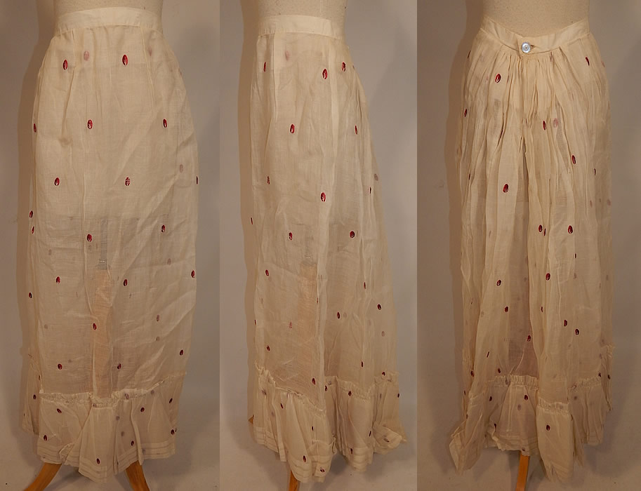 Victorian White Cotton Organdy Fabric Red Berry Polka Dot Embroidered Skirt
This antique Victorian era white cotton organdy fabric red berry polka dot embroidered skirt dates from 1890. It is made of a sheer white light weight crisp cotton organdy fabric, with a red and white stitched embroidered berry polka dot design. 