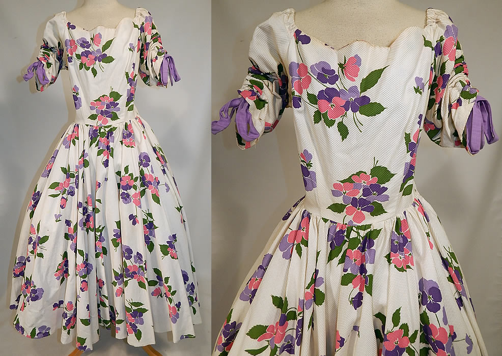 Vintage White Cotton Pique Pansy Print Full Circle Skirt Dress
This vintage white cotton pique pansy print full circle skirt dress dates from the 1950s. It is made of a white cotton pique textured waffle ribbed fabric, with shades of pink, purple and green leaf floral pansy print design.