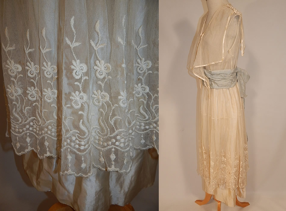 Edwardian White Net Embroidered Lace Sailor Middy Top Blue Sash Belted Dress
This lovely lace long tea length dress has a middy top overlay with sailor collar, silk button trim accents, is sleeveless, with a blue silk ribbon sash belted back bow waist, snap closures down the front top, around the waist and is sheer, lined only in net on the top and white silk on the skirt.