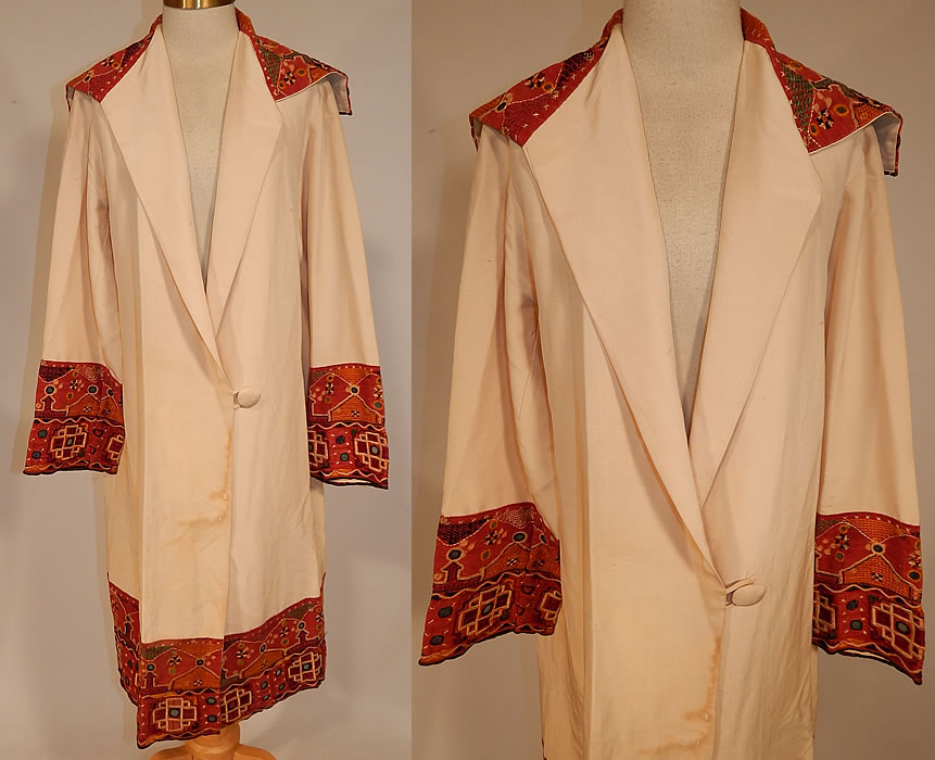 Vintage Indian Gujarati Kutch Work Embroidery Mirrored Art Deco Cocoon Coat
This vintage Indian Gujarati kutch work embroidery mirrored Art Deco cocoon coat dates from the 1920s. It is made of a cream color silk fabric with a natural dyed red linen fabric and colorful decorative crewel chain stitch kutch work embroidery done in the tribal folk patterns from Gujarati, Rajasthan India and Sindh Pakistan. 