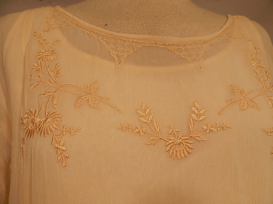 Vintage April Cornell Cream Embroidered Floral Butterfly 1920s Style Wedding Dress
This beautiful bridal 1920s inspired wedding dress has a loose fitting drop waist style, short sleeves, streamer strip panels tulle net layered skirt and comes with the original cream rayon slip dress underneath. 