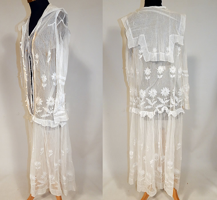 Vintage B. Altman & Co White Cotton Tulle Net Embroidered Lace Drop Waist Dress
This lovely lace dress has loose fitting drop waist style, with a layered top, ruffle trim, sailor collar, open front, no closure, decorative crochet ball button trim, long sleeves, a tiered layered skirt and is sheer, unlined. 
