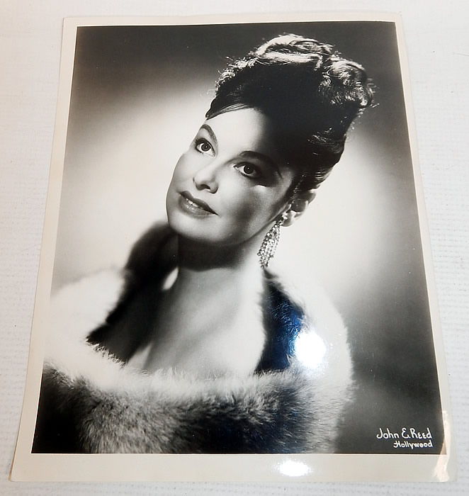 Vintage White Silk de Chine Silver Beaded One Shoulder Grecian Goddess Gown
This custom made evening gown is from the estate of Karen Wessler who performed on the Tennessee Ernie Ford Show as one of "The Top Twenty", Ernie's back-up group (see publicity photo stills below).