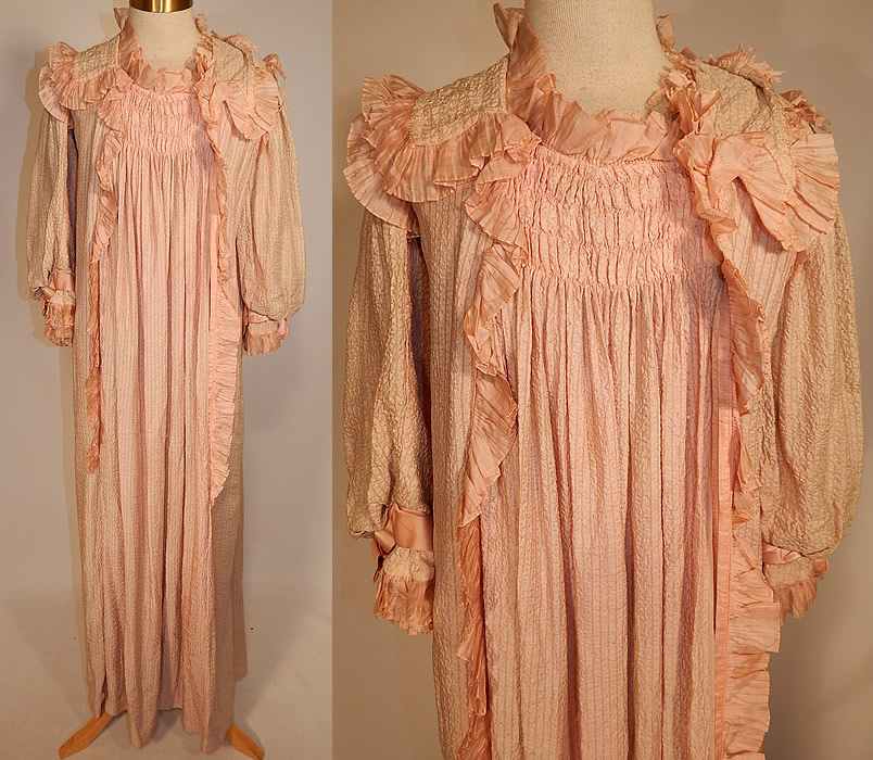 Victorian Pink Crinkle Crepe Silk Ruffle Morning Tea Gown Wrapper Robe Dress
This antique Victorian pink crinkle crepe silk ruffle morning tea gown wrapper robe dress dates from 1900. It is made of a pale pastel pink crinkle crepe silk fabric, with a striped ribbed texture and smocking ruched gathering on the front and back top. 