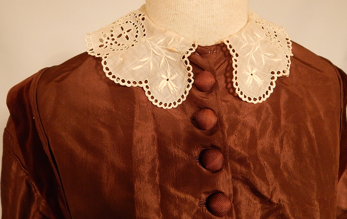 Victorian Civil War Era Brown Silk Taffeta Hoop Skirt Dress & Velvet Bow Belt Sash
It is made of a chocolate brown color silk taffeta fabric, with brown velvet trim edging. This beautiful brown gown has a long floor length very full hoop skirt (hoop not included), with fitted bodice, long sleeves, a white cotton batiste broderie anglaise eyelet embroidery cutwork lace collar, silk covered button front closure and is fully lined. 