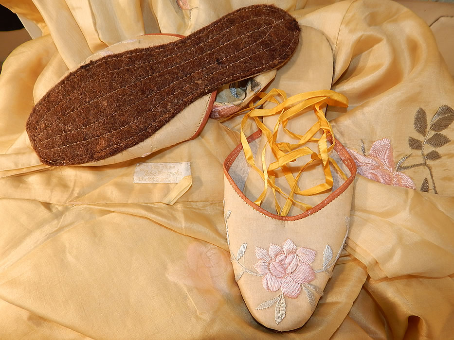 Vintage Japanese Yellow Silk Embroidered Kimono Robe Sash & Slippers
Included with the robe is a matching pair of silk embroidered slippers shoes, with yellow silk ribbon lacing ties and woven horse hair stitched bottom soles. The slippers measure 9 1/2 inches long and 3 inches wide. The outfit is in excellent condition and appears to have never been worn. This is truly a rare and wonderful piece of wearable antique Japanese textile art!