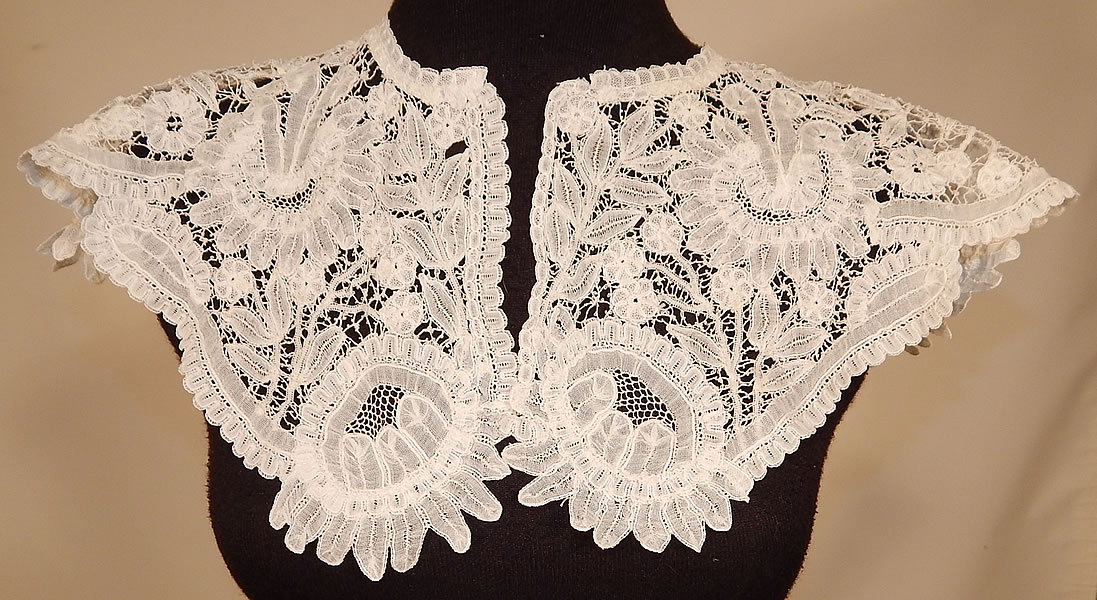 Victorian Antique Hand Made White Duchesse Bobbin Lace Shawl Collar
This Victorian era antique hand made white Belgian Brussels Duchesse bobbin lace shawl collar dates from the late 19th century.