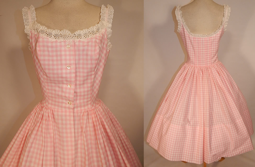 Vintage Designed by Jax Pink White Cotton Check Gingham Lace Circle Skirt Dress
This pretty pink sun dress resembles the one worn and made popular by Brigitte Bardot when she wed actor Jacques Charrier in the summer of 1959 and was widely copied. It has scoop necklines edged in white lace, sleeveless with lace trim shoulder straps, pleated back, a full circle skirt, button front top closure and is unlined. 