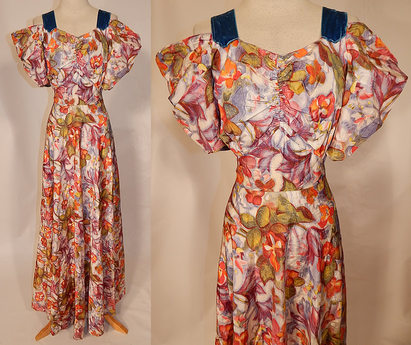 Vintage Orange Blossom Floral Pastel Print Rayon Taffeta Off Shoulder Dress Gown
This vintage orange blossom floral pastel print rayon taffeta off shoulder dress gown dates from the 1940s. It is made of a rayon taffeta fabric, with a colorful pastel print of orange blossom flowers and blue velvet ribbon trim on the top. This gorgeous gown has an off the shoulder style with blue velvet straps, full puffy sleeves, a gathered front sweetheart neckline, plunging V back with blue velvet ribbon trim, long floor length full skirt, side snap closures and is unlined. 